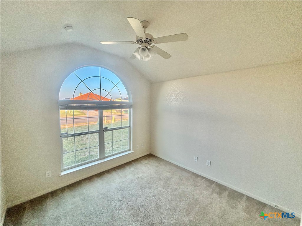 3610 Armstrong County Court Killeen, TX 76549 - Photo 16 of 29 an empty room with windows and ceiling fan