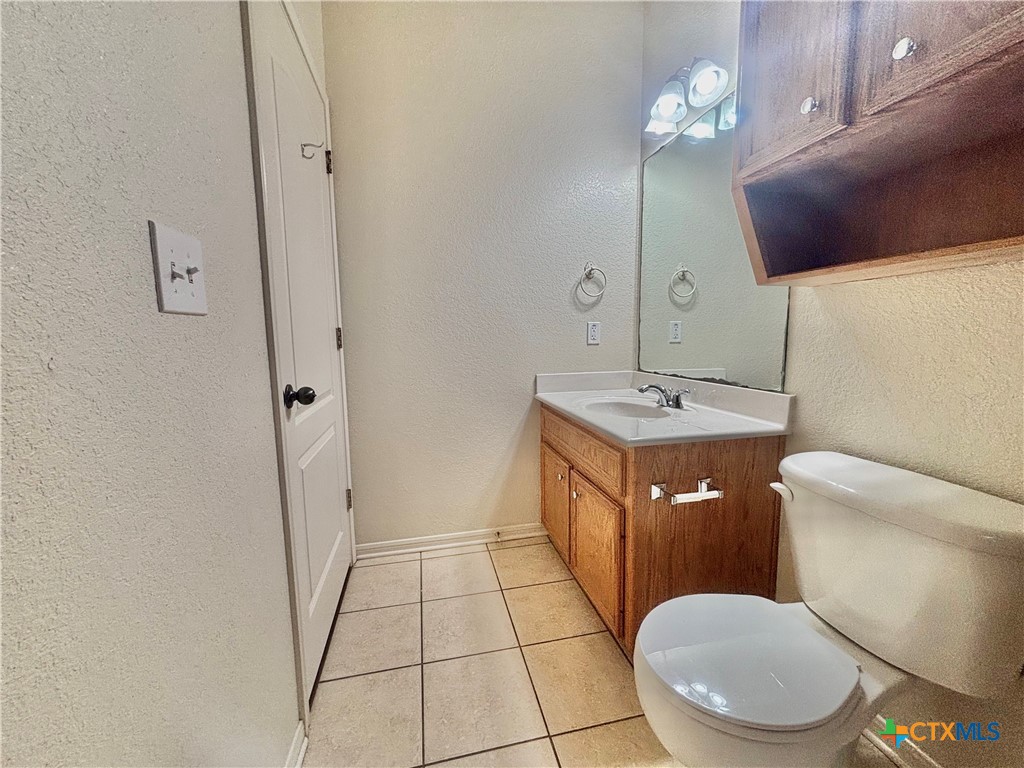 3610 Armstrong County Court Killeen, TX 76549 - Photo 20 of 29 a bathroom with a sink a toilet and shower