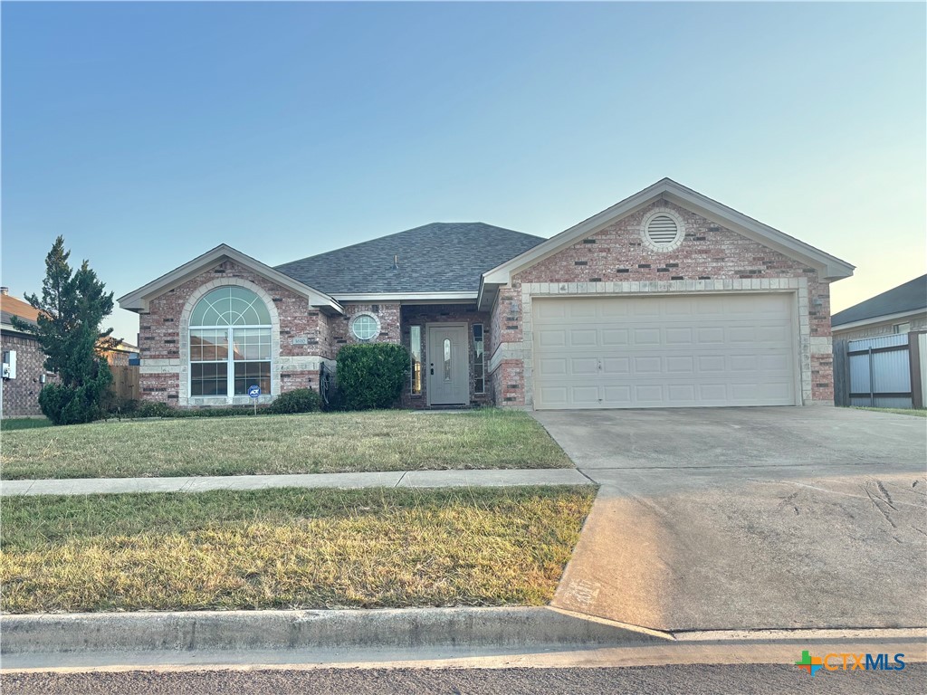 3610 Armstrong County Court Killeen, TX 76549 - Photo 2 of 29 a front view of a house with a yard and garage