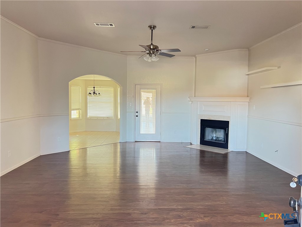 3610 Armstrong County Court Killeen, TX 76549 - Photo 6 of 29 an empty room with wooden floor a fireplace