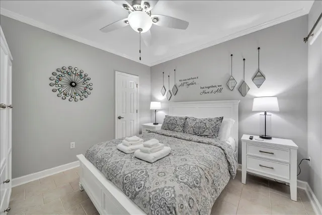 a en suite bathroom with a granite countertop sink and a mirror