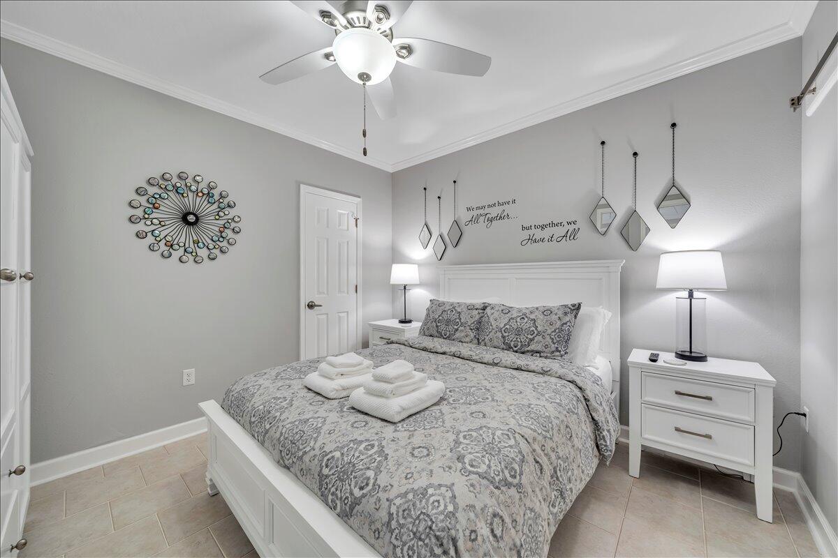 1245 Graves Harbor Trail, Unit 217 Huddleston, VA 24104 - Photo 16 of 39 a bedroom with a bed and a chandelier