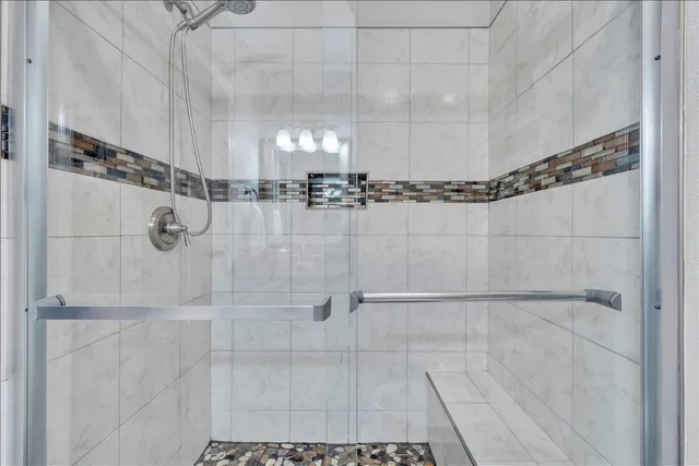 an aerial view of a house with a garden and a lake view