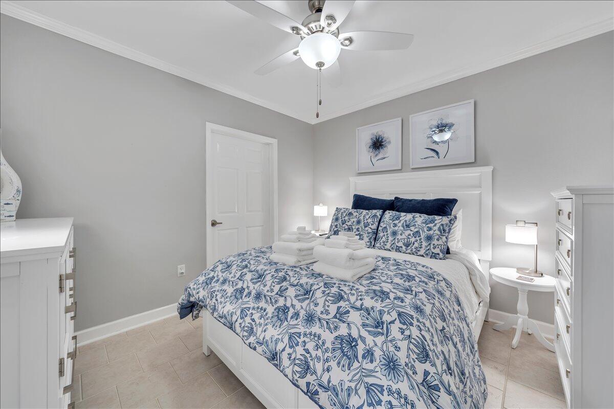 1245 Graves Harbor Trail, Unit 217 Huddleston, VA 24104 - Photo 21 of 39 a bedroom with a bed and a chandelier