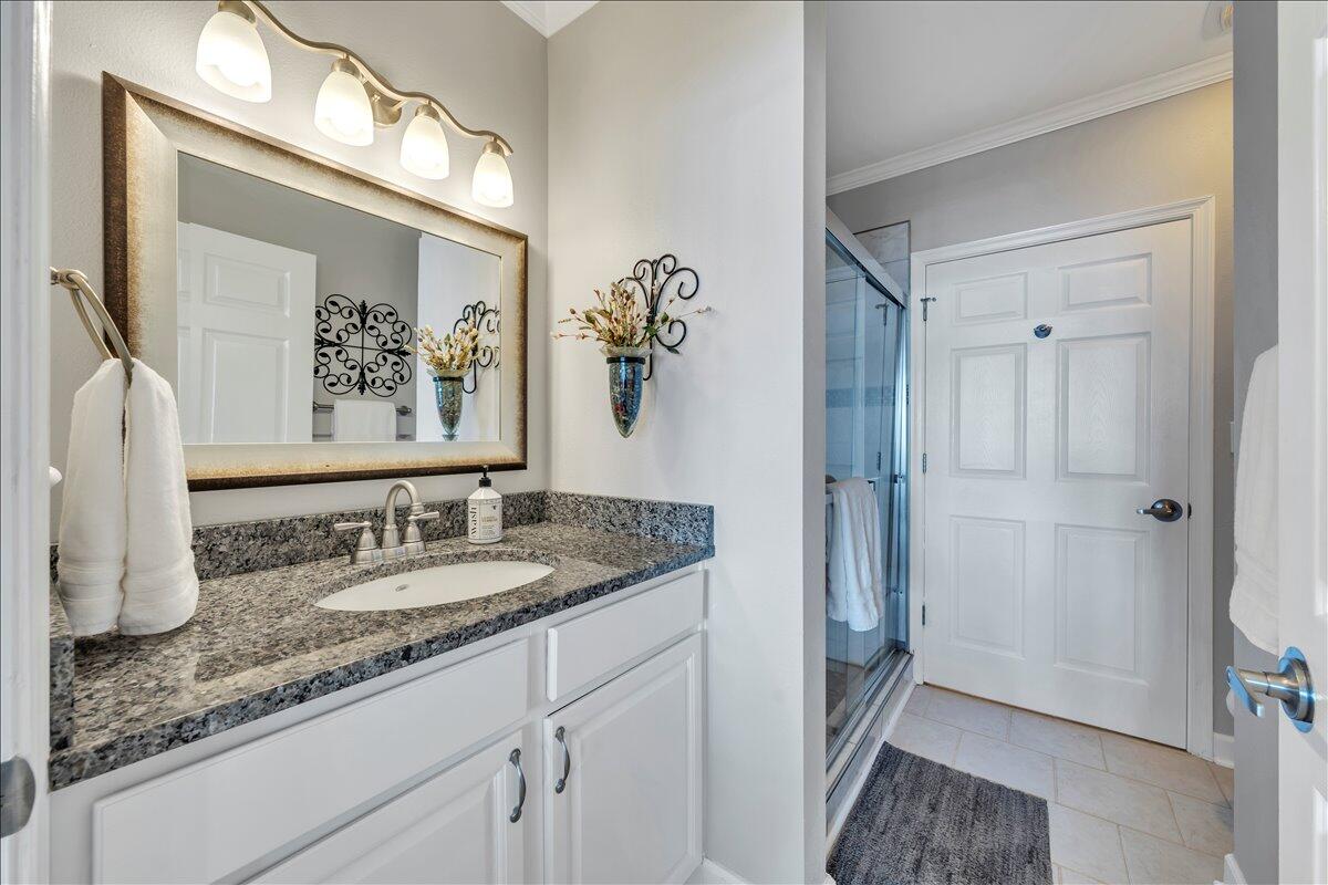 1245 Graves Harbor Trail, Unit 217 Huddleston, VA 24104 - Photo 23 of 39 a en suite bathroom with a granite countertop sink and a mirror