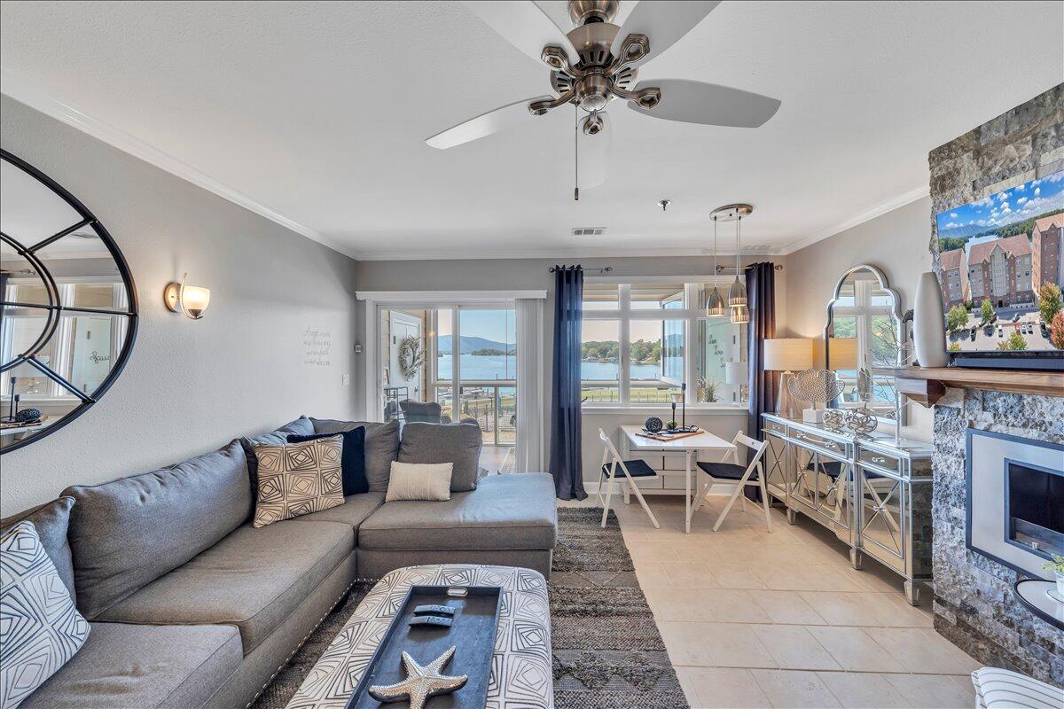 1245 Graves Harbor Trail, Unit 217 Huddleston, VA 24104 - Photo 6 of 39 a living room with furniture a fireplace and a flat screen tv