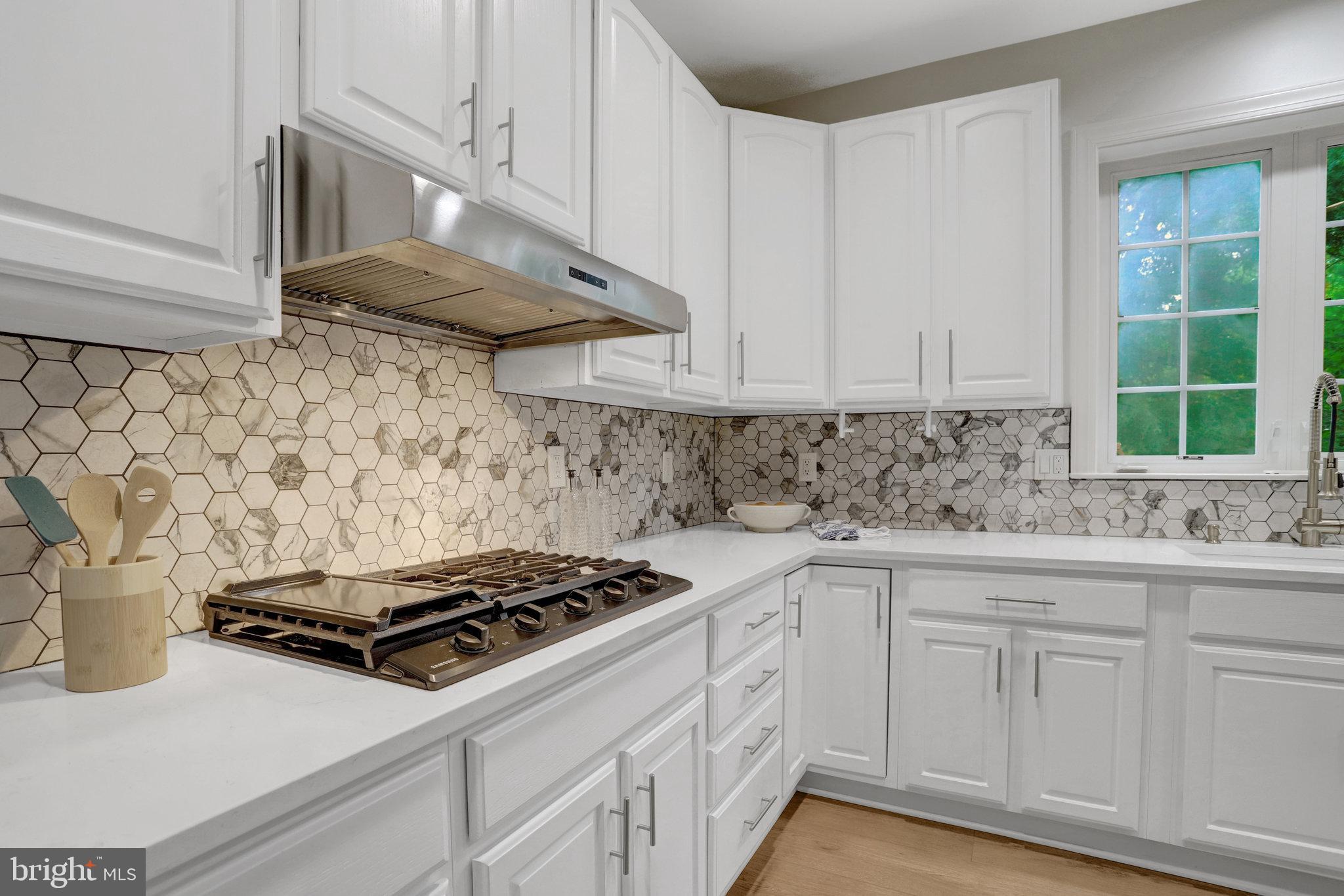 3905 Cook Street Alexandria, VA 22311 - Photo 12 of 39 a kitchen with white cabinets and white stove