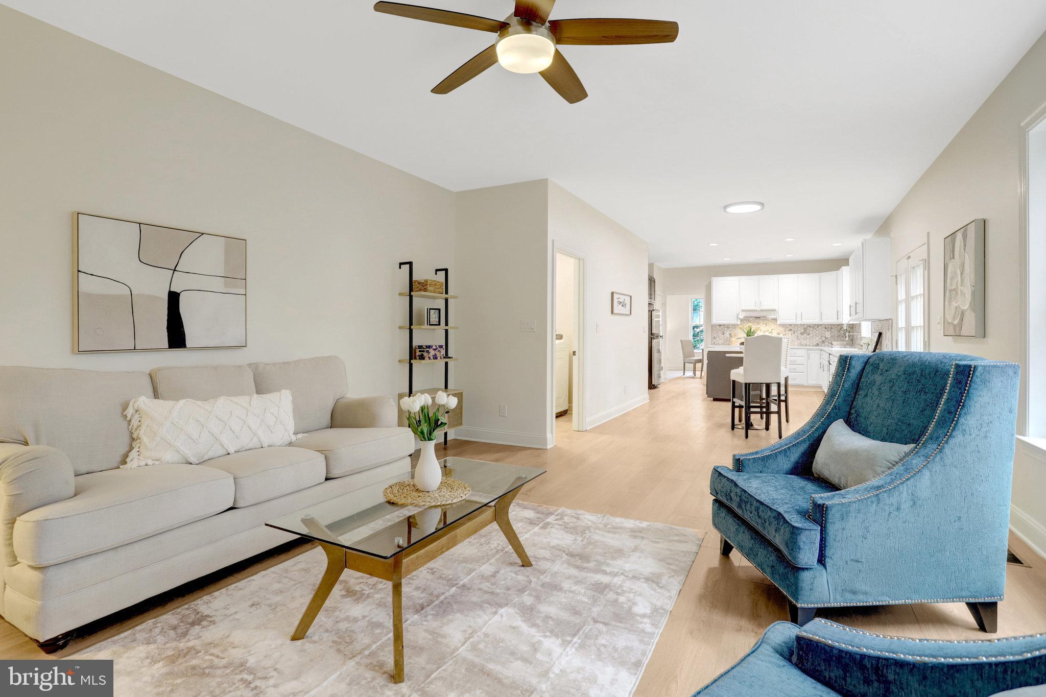 3905 Cook Street Alexandria, VA 22311 - Photo 16 of 39 a living room with furniture and a chandelier