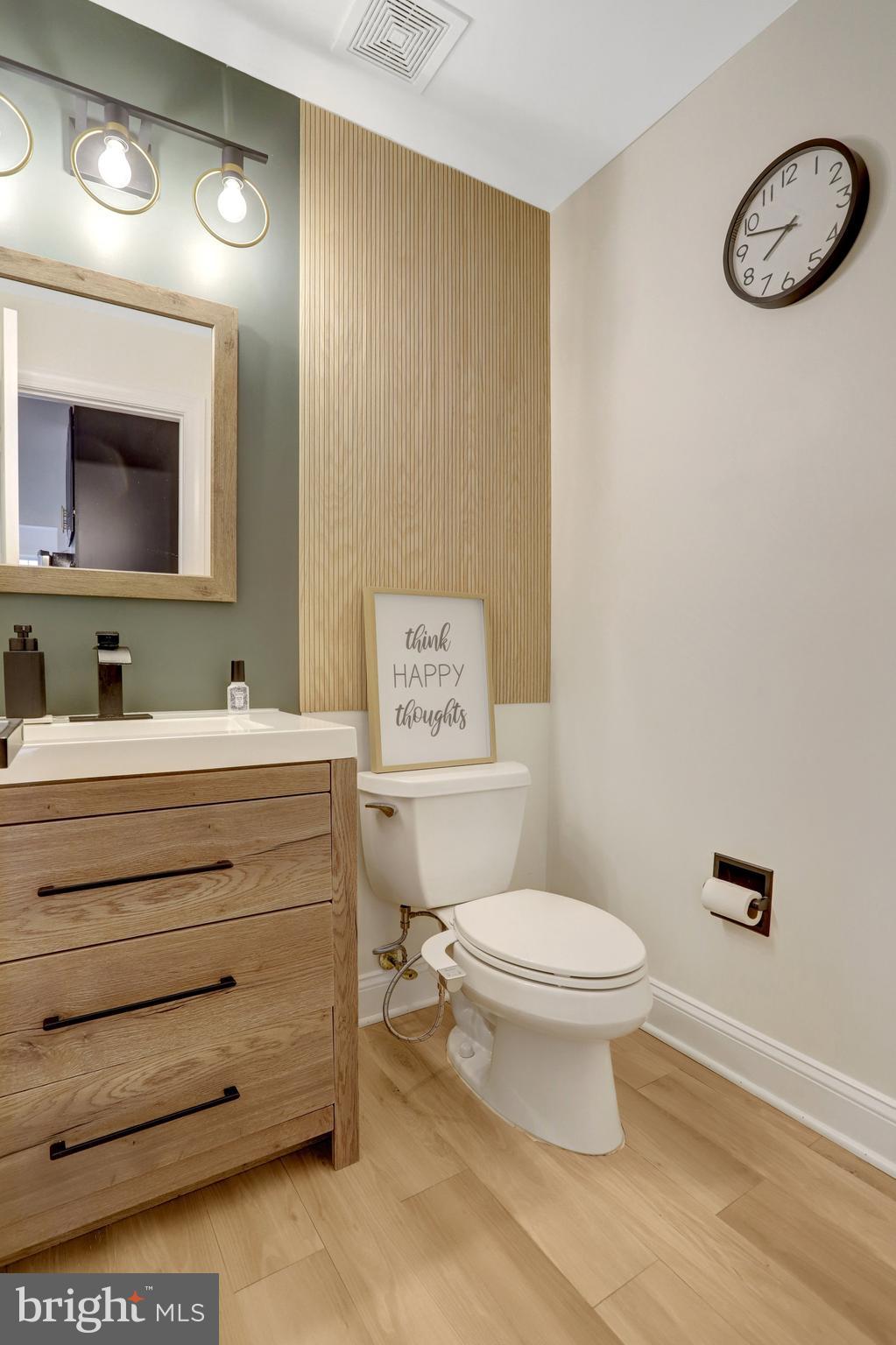 3905 Cook Street Alexandria, VA 22311 - Photo 19 of 39 a bathroom with a toilet sink and mirror