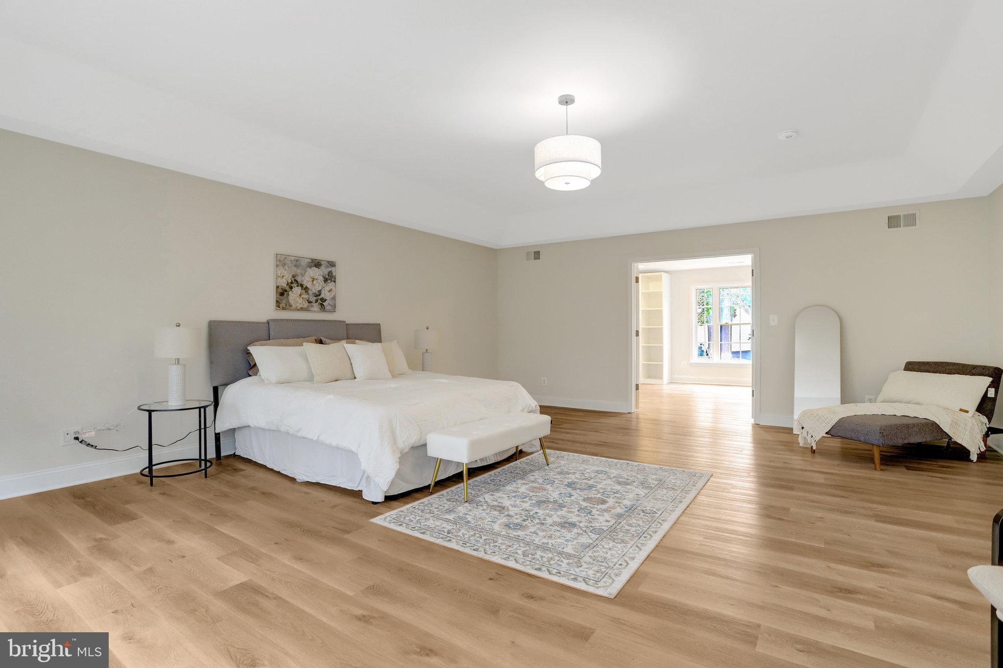 3905 Cook Street Alexandria, VA 22311 - Photo 26 of 39 a bedroom with a bed and wooden floor