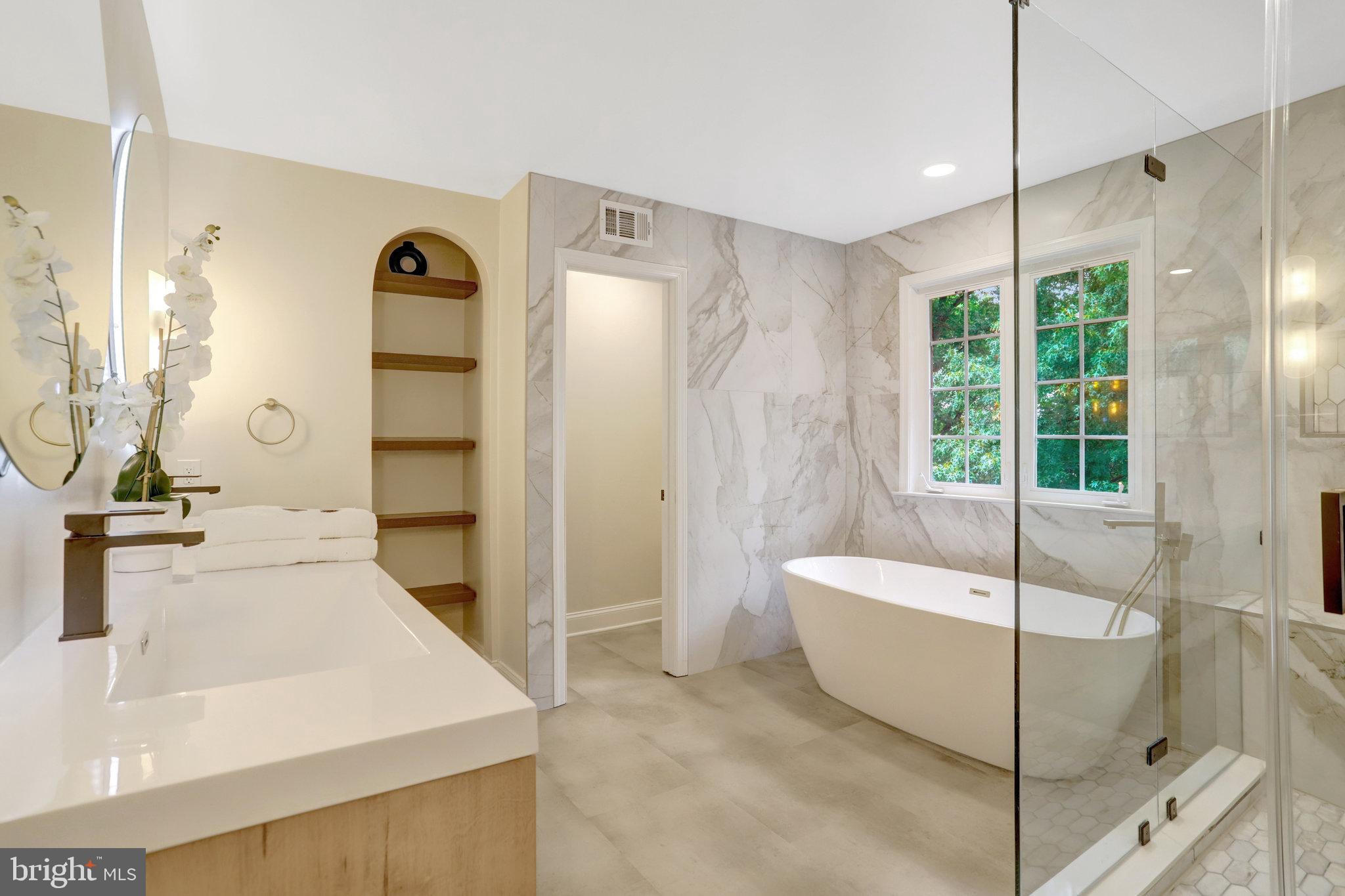 3905 Cook Street Alexandria, VA 22311 - Photo 28 of 39 a spacious bathroom with a double vanity sink and a mirror
