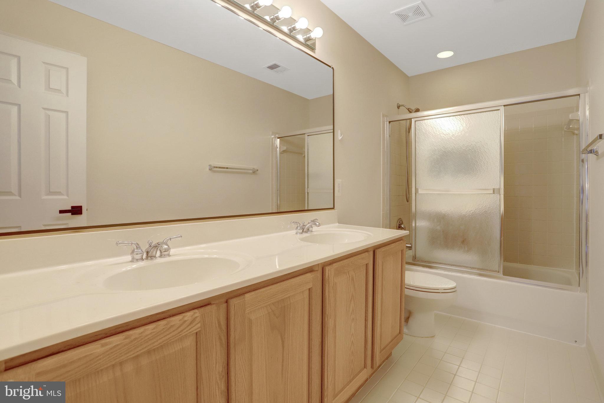 3905 Cook Street Alexandria, VA 22311 - Photo 32 of 39 a bathroom with a sink and a mirror