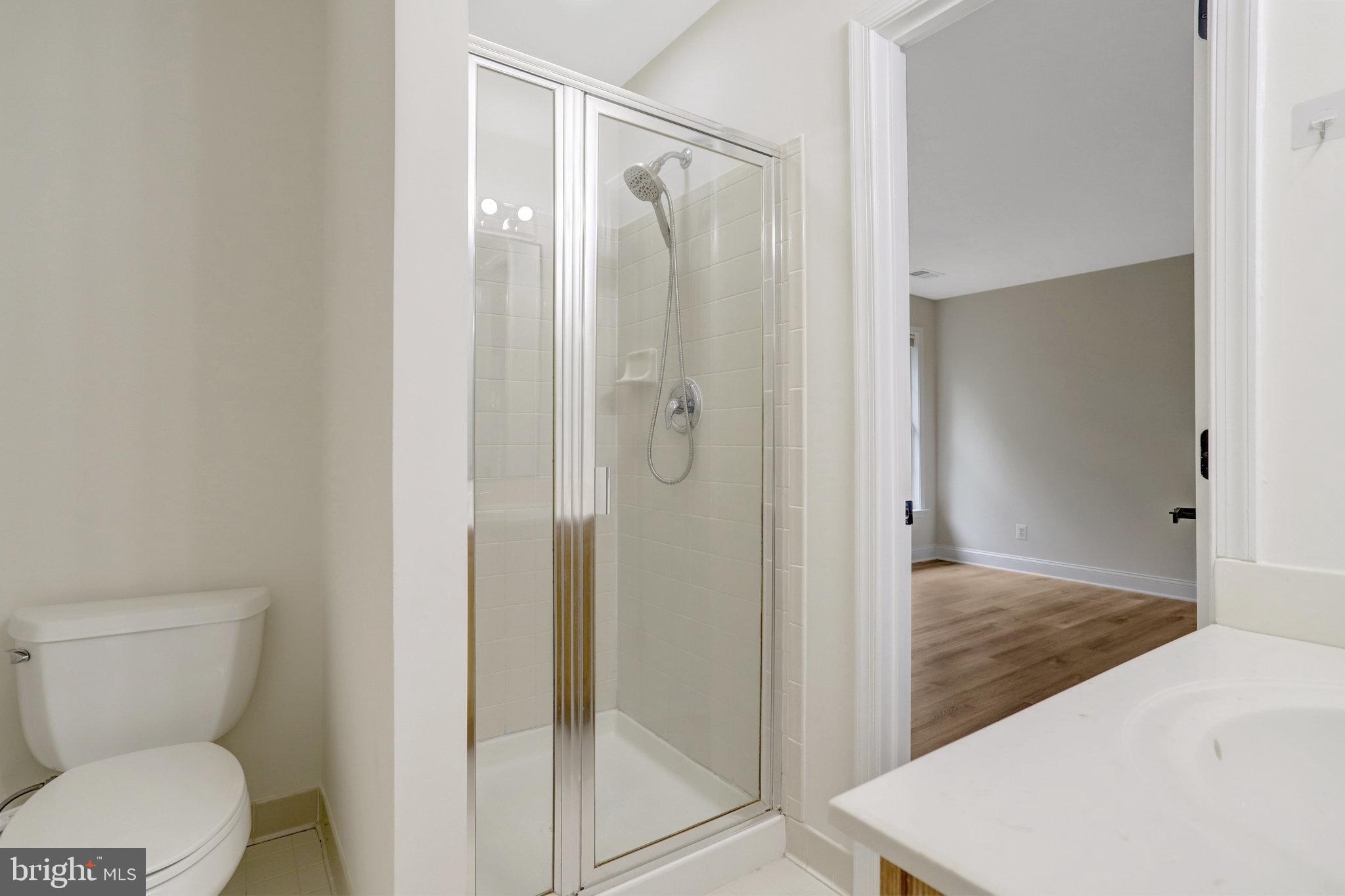 3905 Cook Street Alexandria, VA 22311 - Photo 34 of 39 a bathroom with a shower and toilet