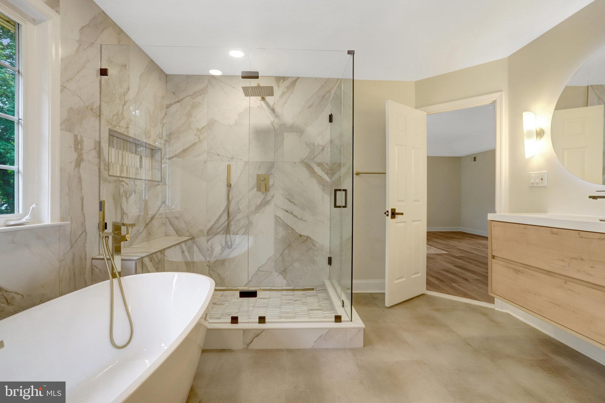 3905 Cook Street Alexandria, VA 22311 - Photo 6 of 39 a bathroom with a tub shower and sink