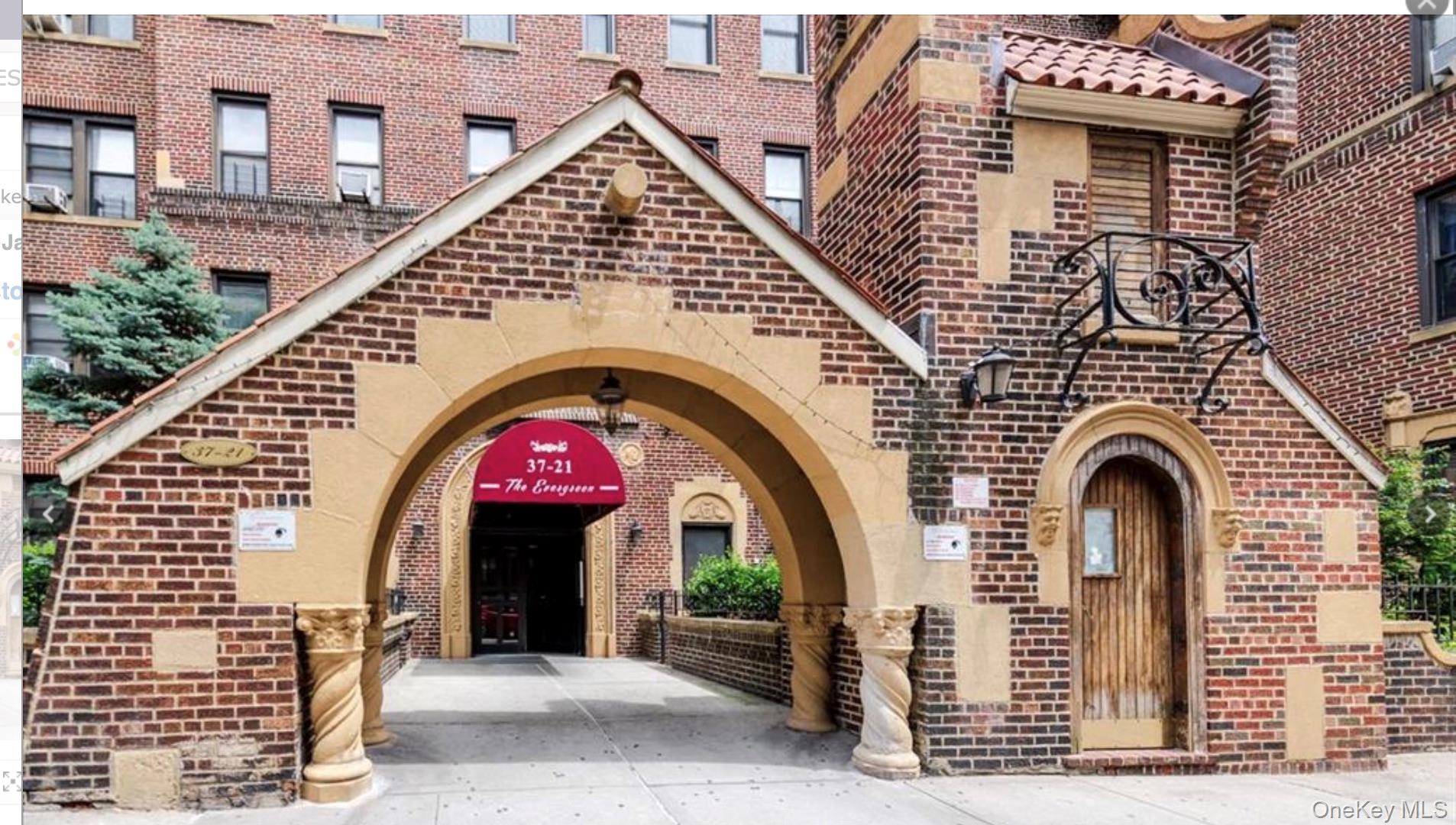 a view of a wooden door with a small yard