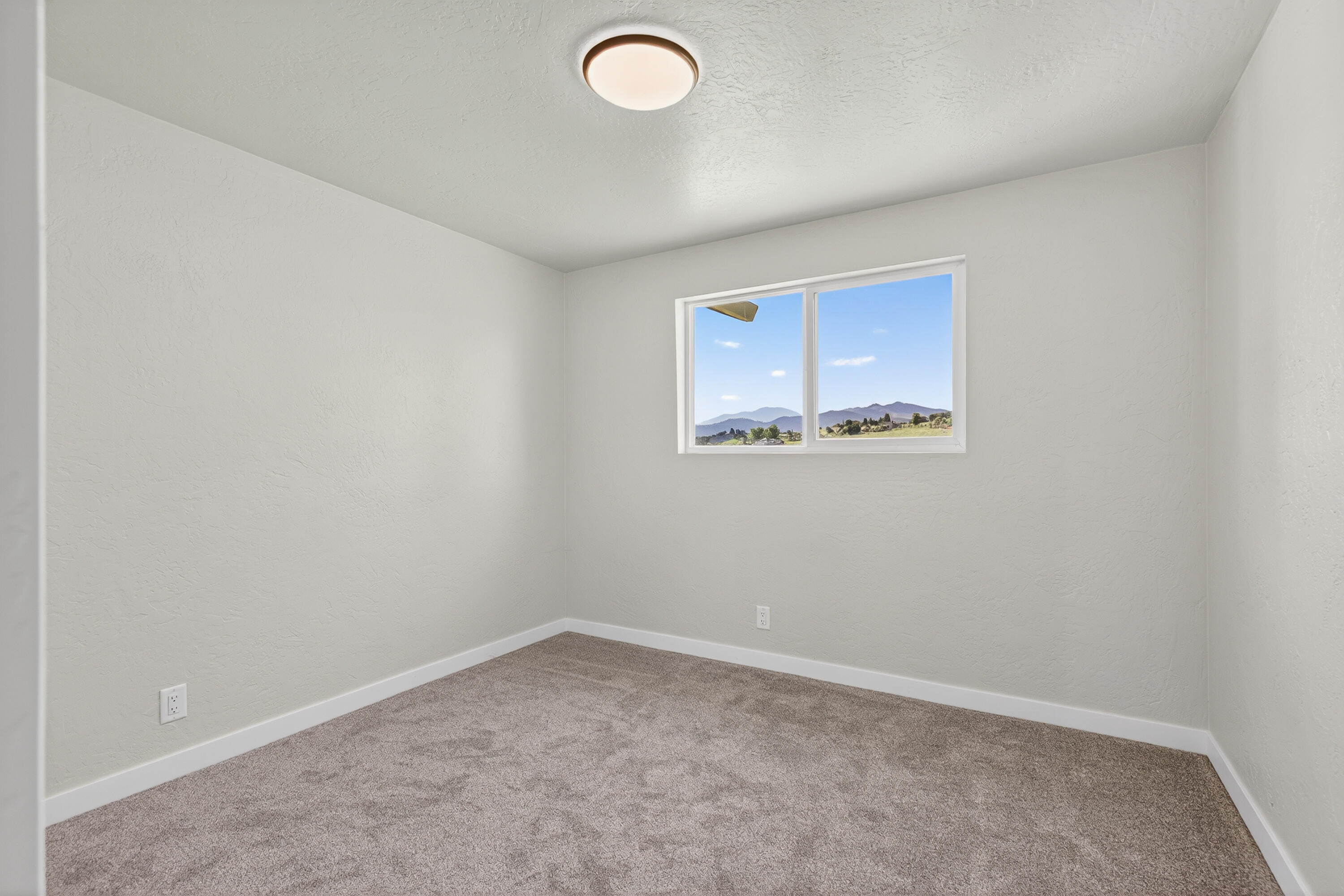 550 Experiment Station Road Medford, OR 97501 - Photo 13 of 27 an empty room with a window