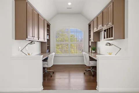 a view of kitchen with granite countertop lots of counter top space