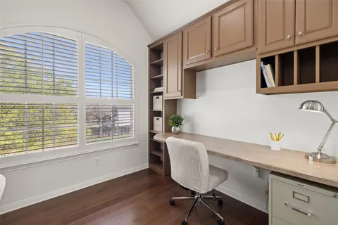 a view of a kitchen with workspace and windows