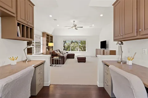 a kitchen that has a sink and a stove with white countertops