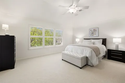 a bed room with a bed and a window