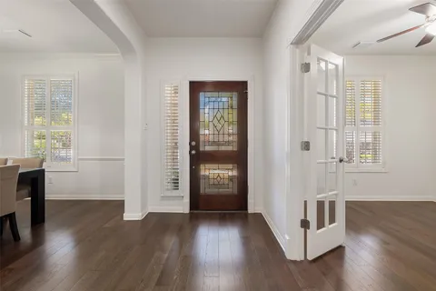 a view of an entryway with wooden floor