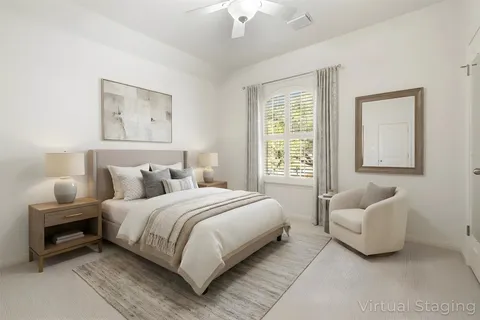 a bedroom with a bed and a couch