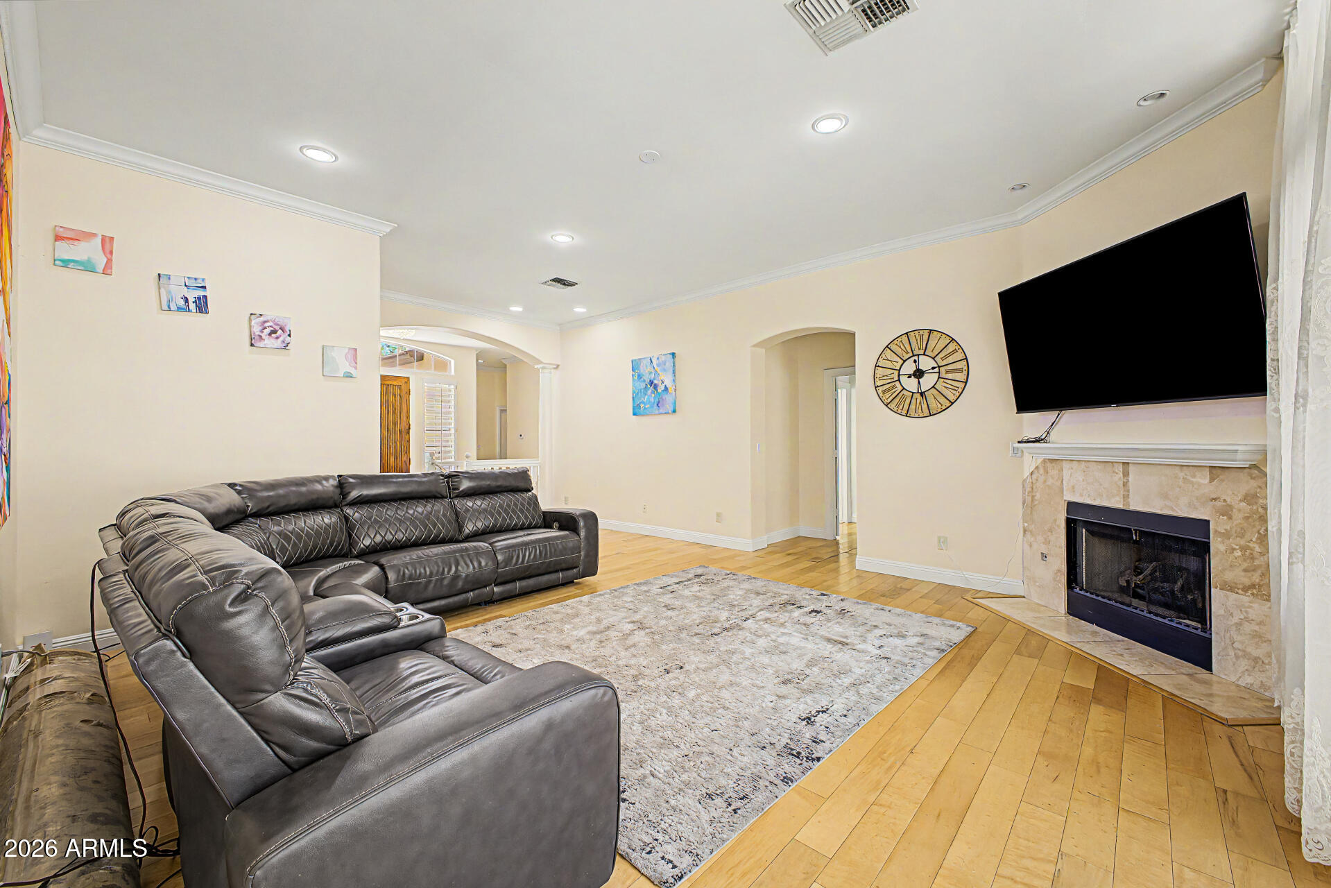 808 West Citrus Way Phoenix, AZ 85013 - Photo 6 of 35 a living room with furniture a fireplace and a flat screen tv