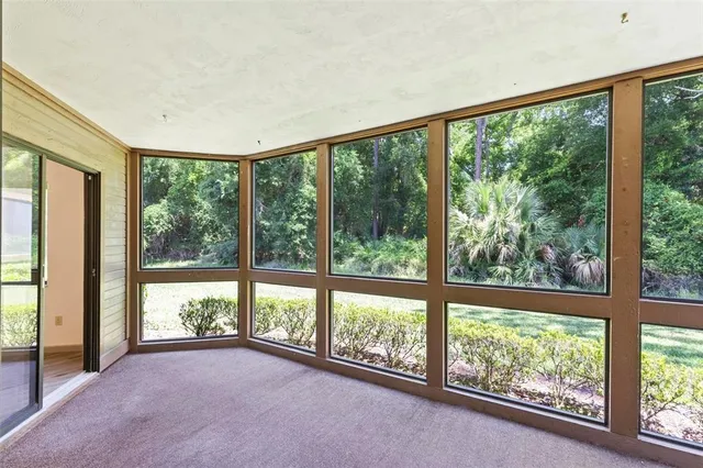 a view of a room with large windows