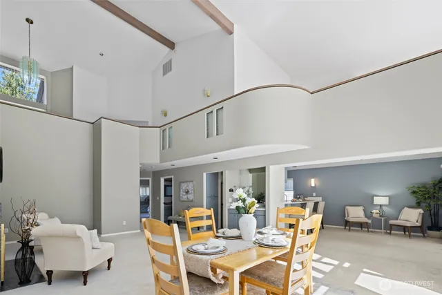 a dining room with furniture and wooden floor