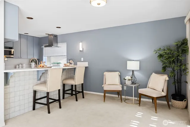 a living room with furniture and a lamp