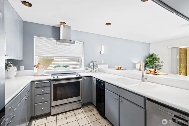 a kitchen with a sink stove and cabinets