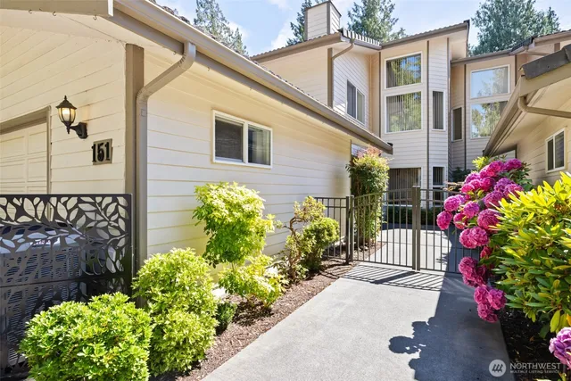 a front view of a house having fountain