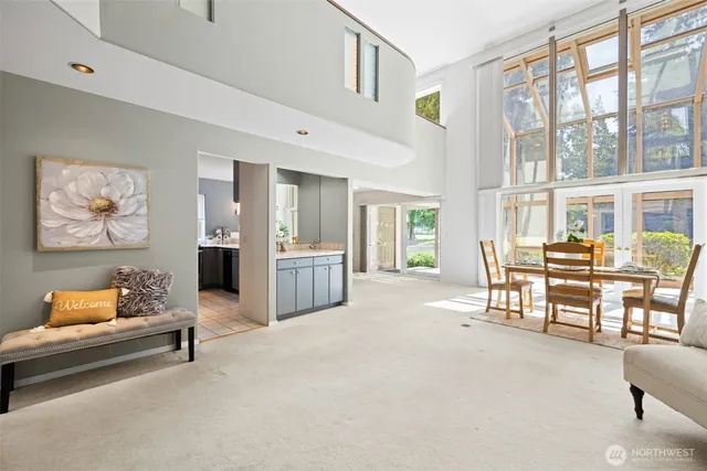 a spacious bedroom with furniture and a chandelier