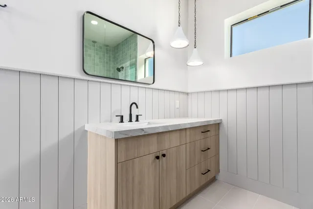 a view of a room with a ceiling fan and window