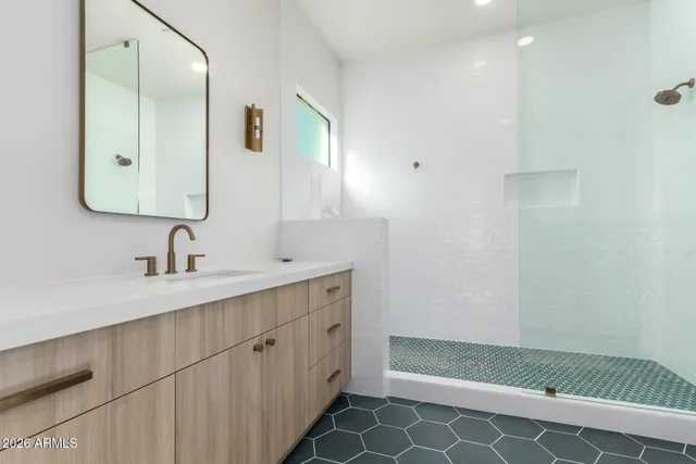 a kitchen with a stove sink and cabinets