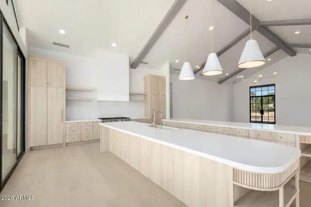 a bathroom with a bathtub and cabinets