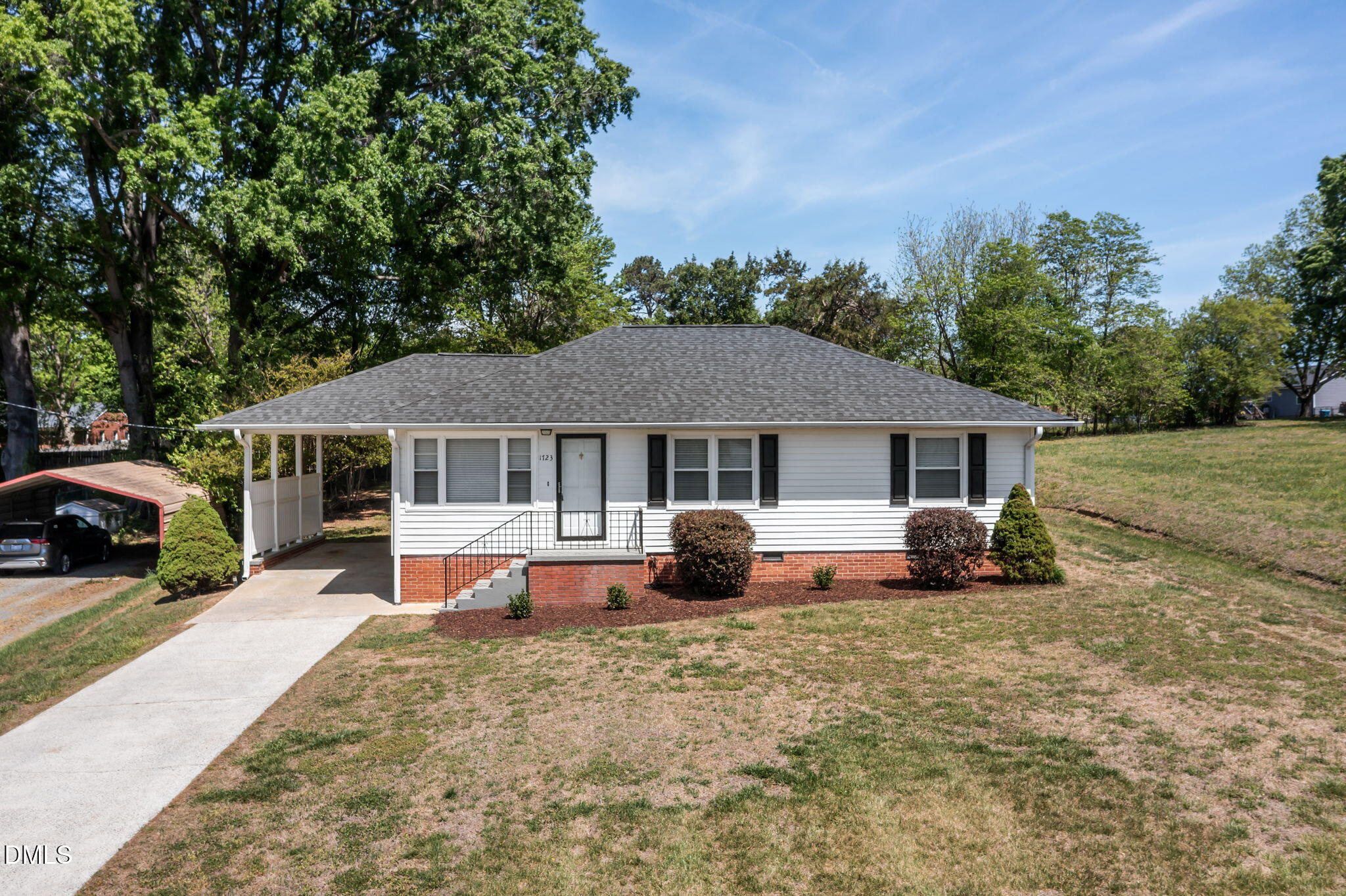 1723 Power Line Road Elon, NC 27244 - Photo 1 of 22 a view of a house with backyard and sitting area