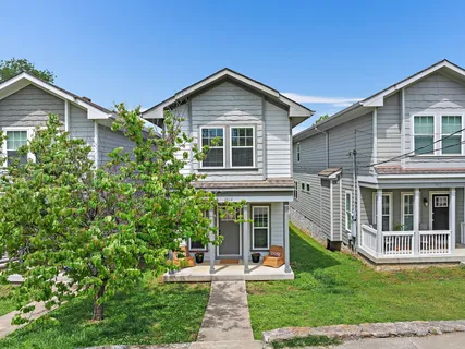 front view of a house with a yard