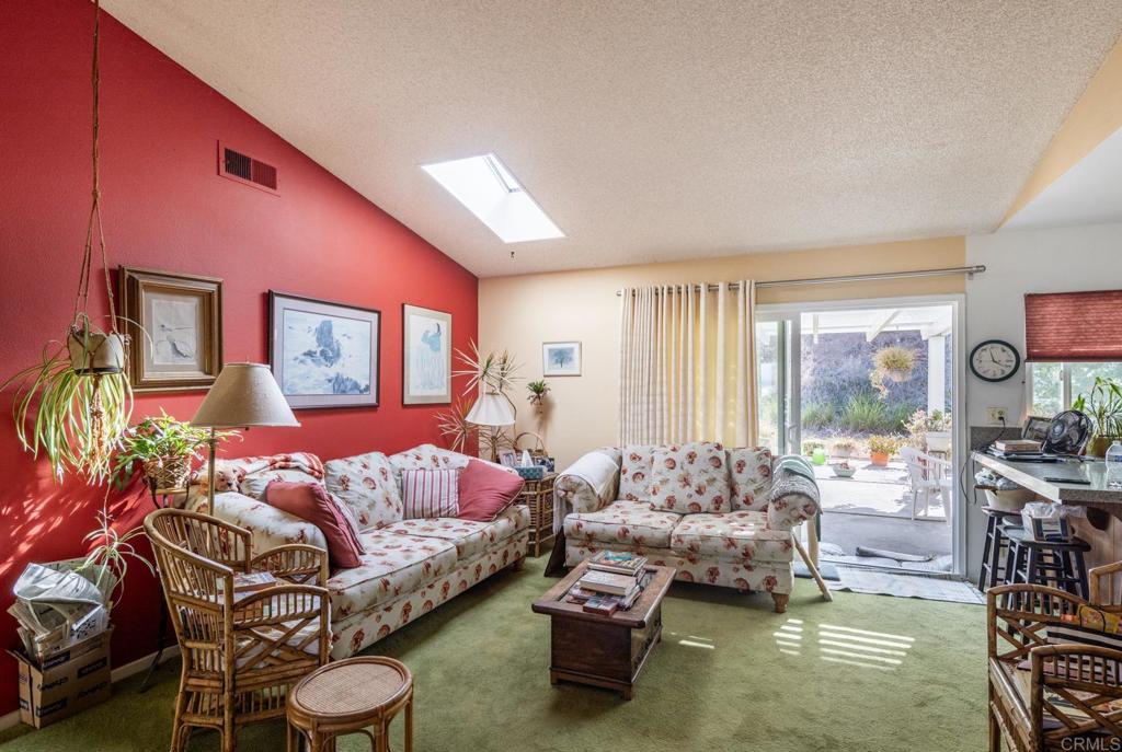 246 Witham Road Encinitas, CA 92024 - Photo 3 of 11 a living room with furniture and a large window