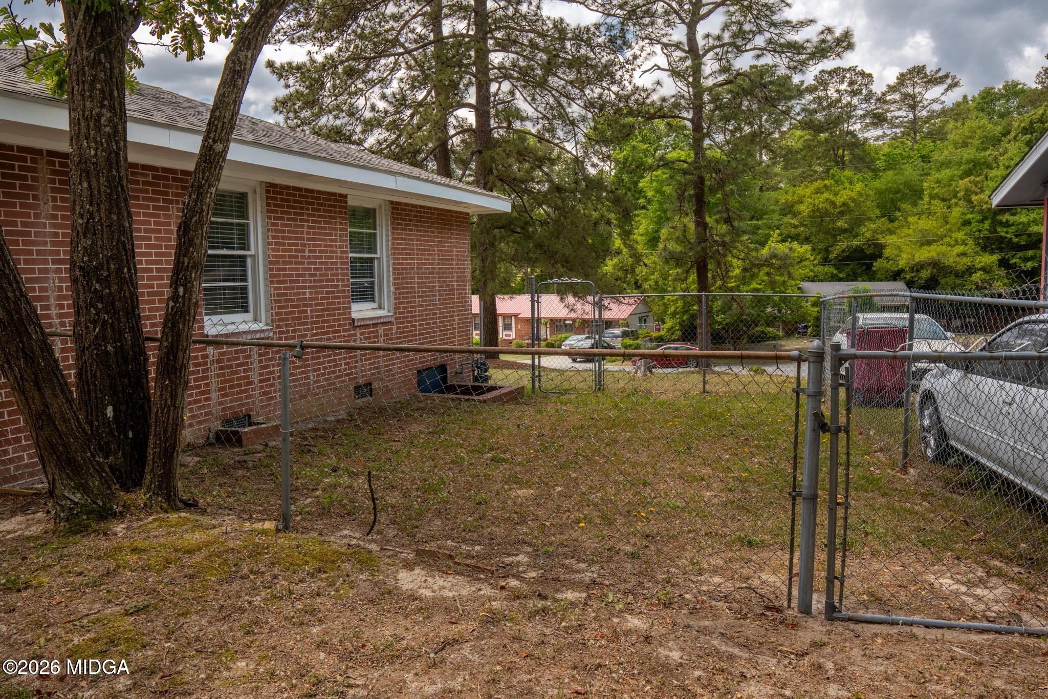 3319 Mohawk Road Macon, GA 31217 - Photo 7 of 38 a backyard of a house with barbeque oven