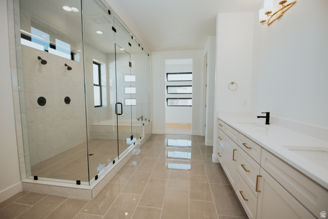 1378 North 1500 West, Unit 8 Mapleton, UT 84664 - Photo 9 of 20 Spacious bathroom featuring a large glass-enclosed shower with multiple showerheads, a built-in bench, and a standalone soaking tub