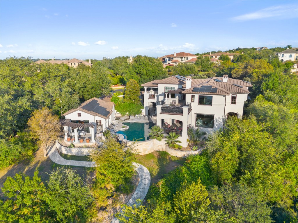 203 Bella Riva Drive Austin, TX 78734 - Photo 1 of 40 aerial view of a house with a garden