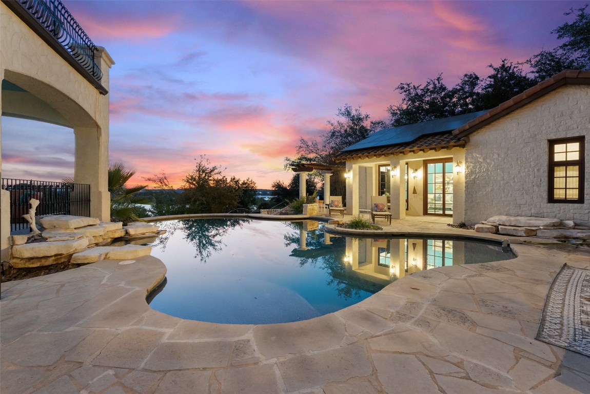 203 Bella Riva Drive Austin, TX 78734 - Photo 12 of 40 a view of a swimming pool with a lounge chairs