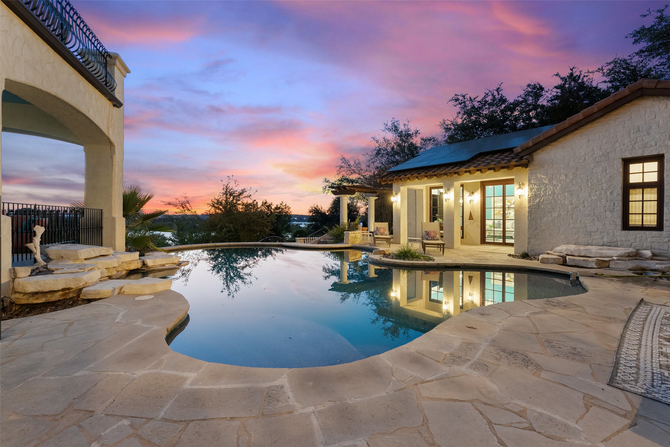 203 Bella Riva Drive Austin, TX 78734 - Photo 12 of 40 a view of a swimming pool with a lounge chairs
