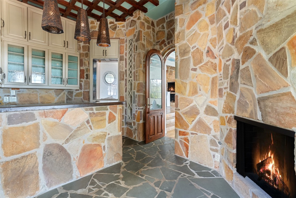 203 Bella Riva Drive Austin, TX 78734 - Photo 16 of 40 a living room with a fireplace and a flat screen tv