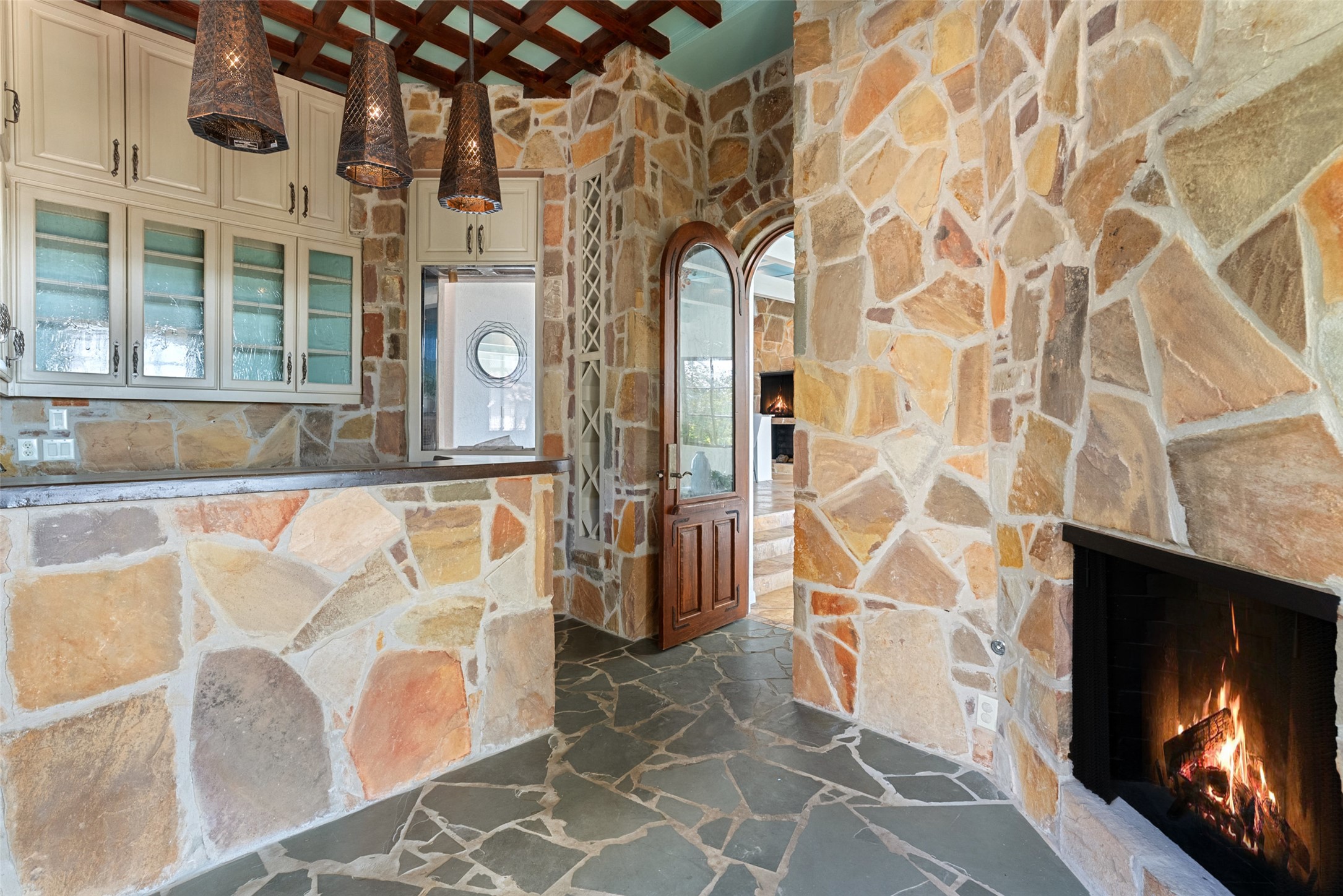 203 Bella Riva Drive Austin, TX 78734 - Photo 16 of 40 a living room with a fireplace and a flat screen tv