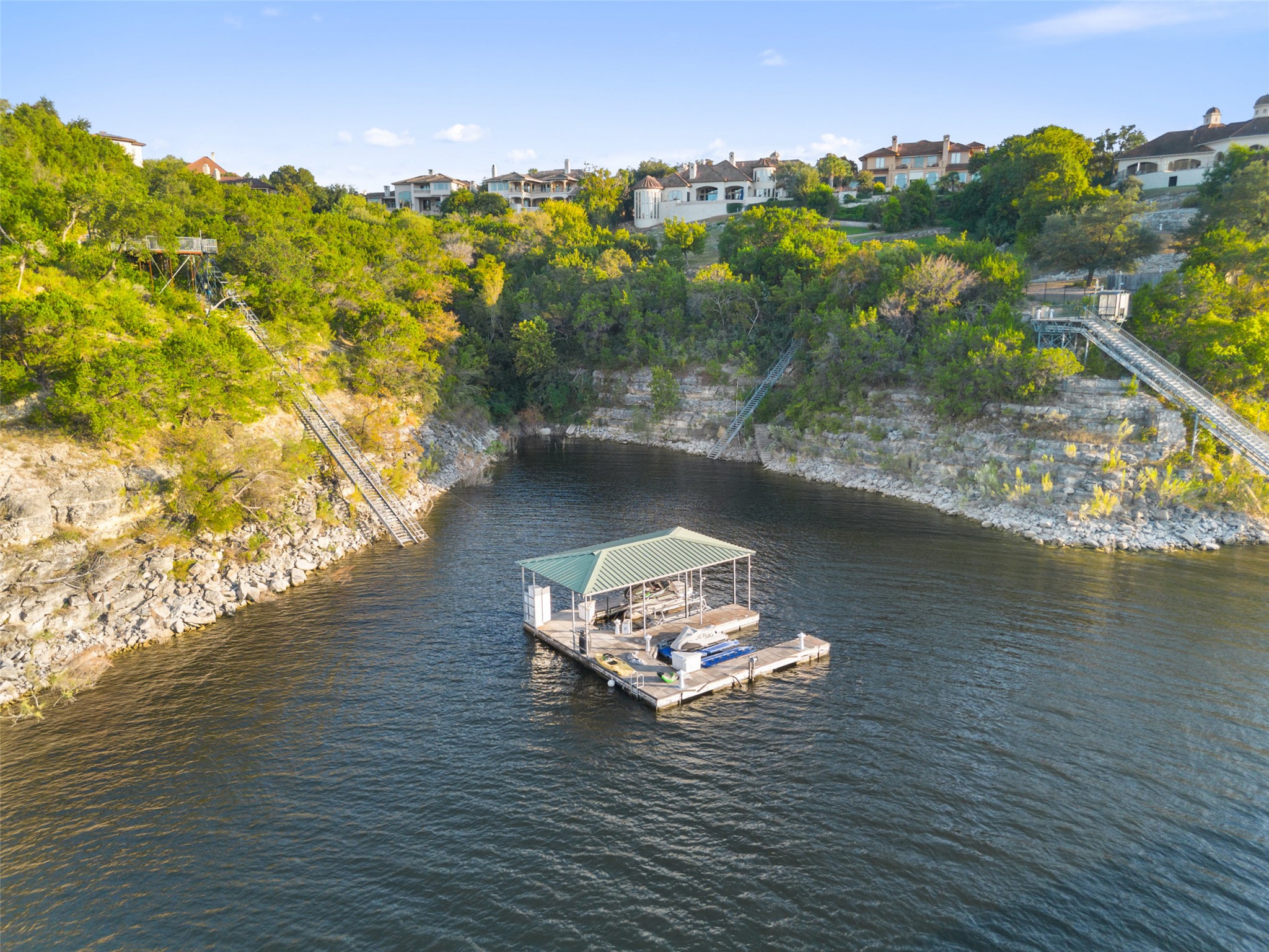 203 Bella Riva Drive Austin, TX 78734 - Photo 2 of 40 A tram from the private observation deck takes you to the private 2-slip boat dock in a protected, deep water cove.