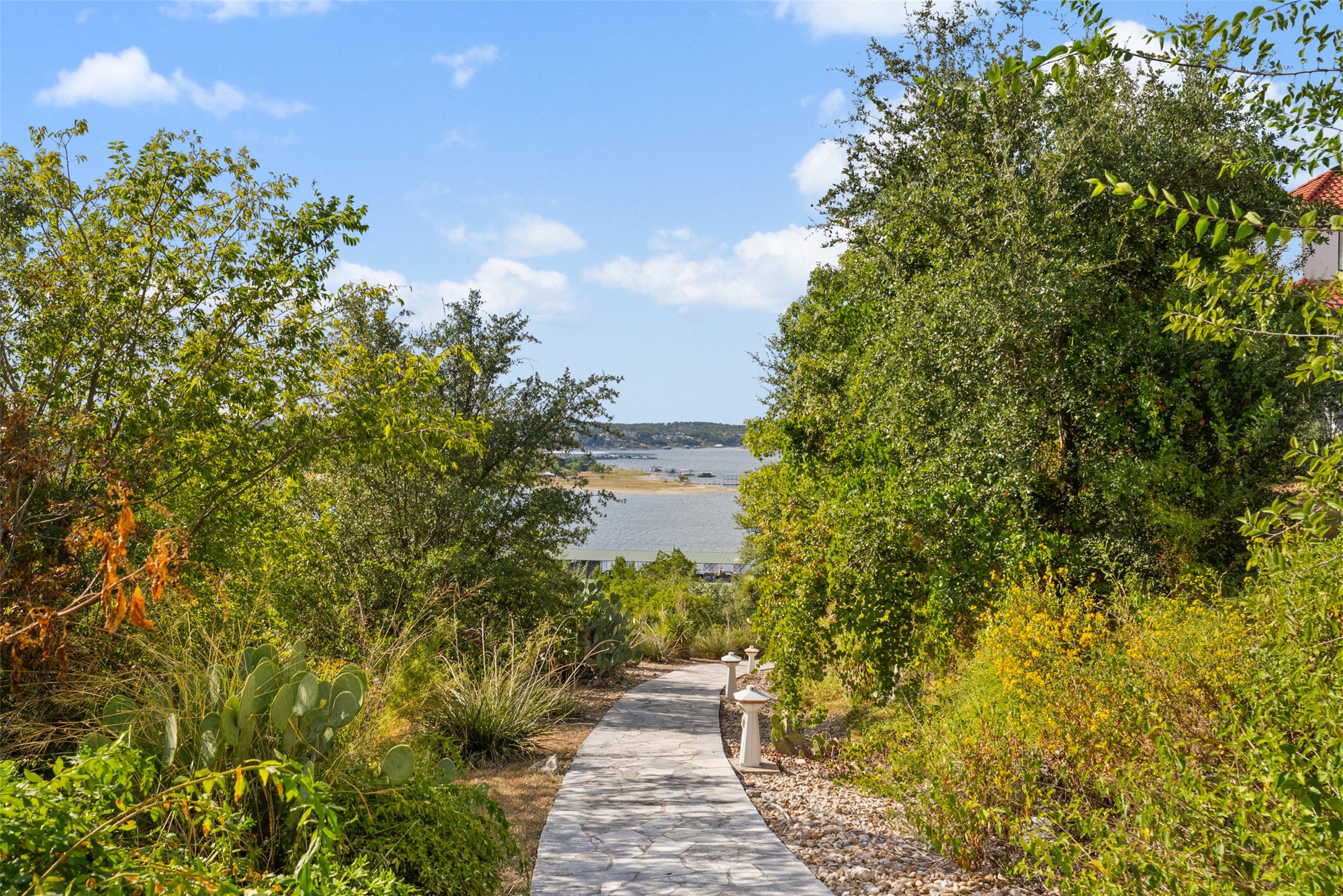 203 Bella Riva Drive Austin, TX 78734 - Photo 22 of 40 manicured grounds clearing the pathway to the lake