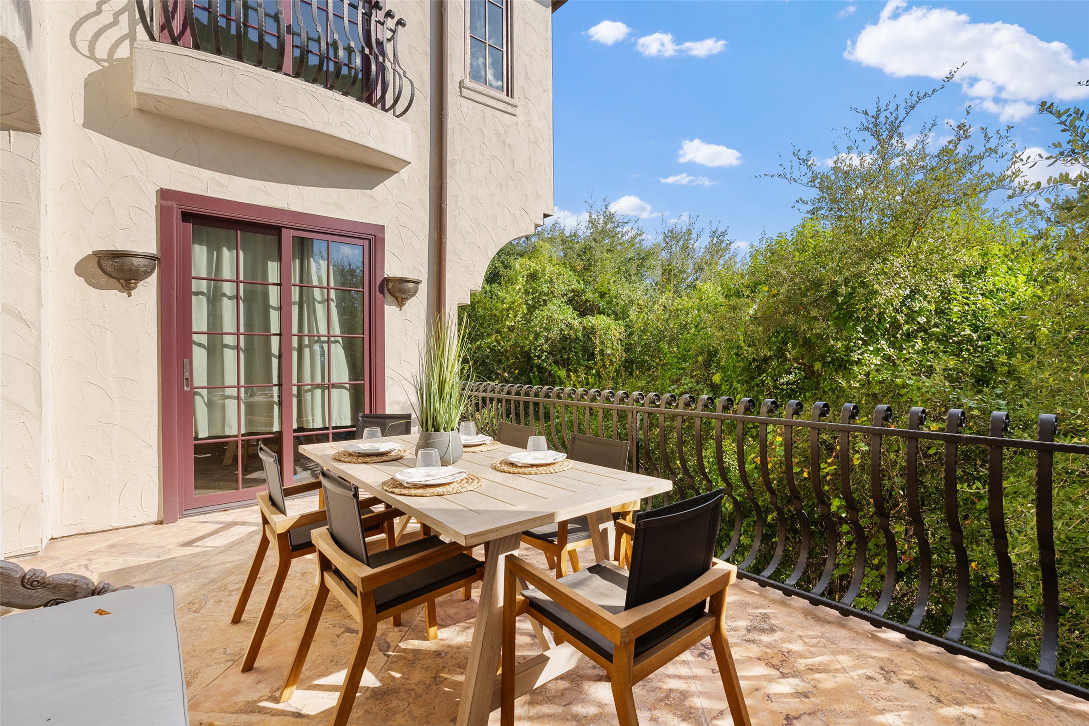 203 Bella Riva Drive Austin, TX 78734 - Photo 30 of 40 a view of a patio with a table and chairs