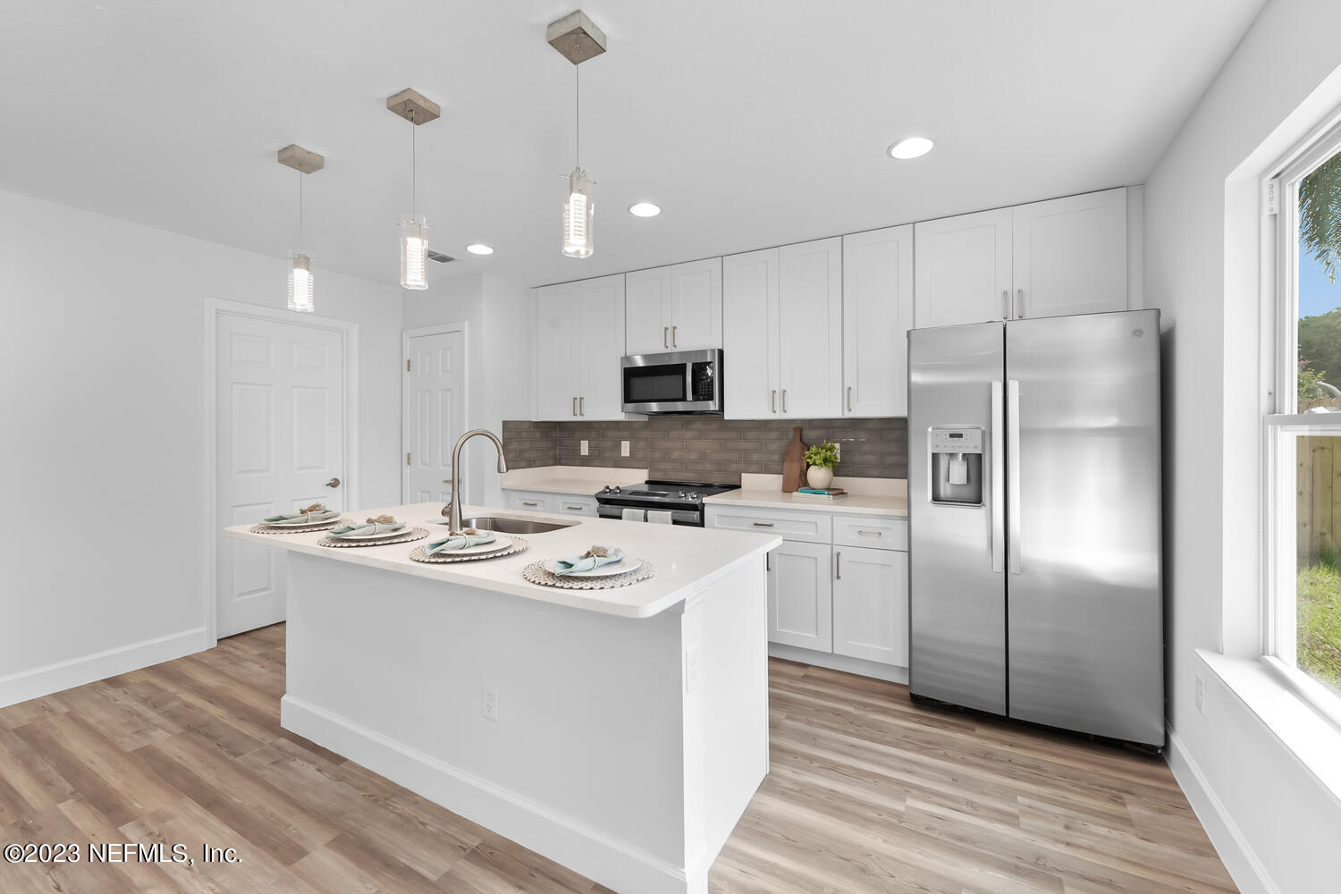 3748 Foxcroft Road Jacksonville, FL 32257 - Photo 11 of 33 a kitchen with stainless steel appliances granite countertop a sink a stove a refrigerator and cabinets